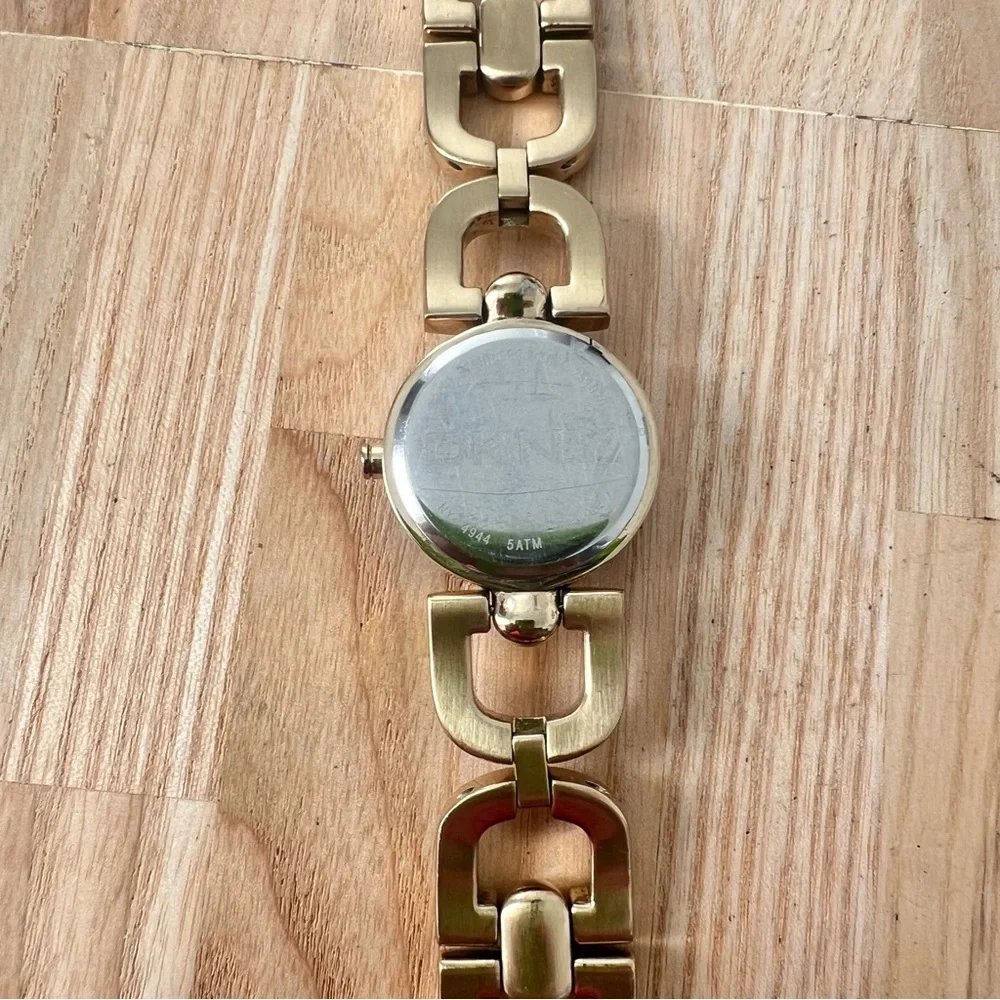 DKNY ladies gold tone crystal studded bracelet watch NEW BATTERY